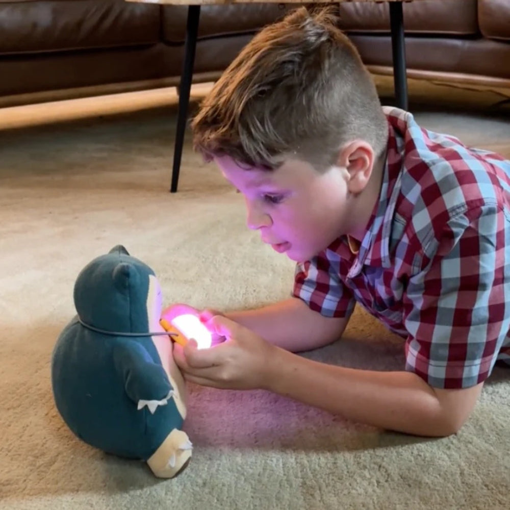 A little boy hangs AI Bubble around his favorite doll's neck and begins chatting with it.